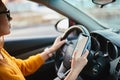 Woman driver using mobile phone screen blank mockup while driving distracted from the road Royalty Free Stock Photo