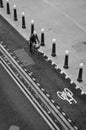 A woman drives her bike through the bike path