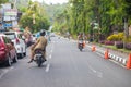A woman drives on a motorbike in Bali / Indonesia