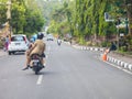 A woman drives on a motorbike in Bali / Indonesia