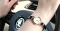 Woman driving with Cacharel watch on wrist a Skoda car