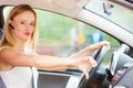 Woman driving car annoyed by heavy traffic