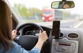 A woman driving a car on a fast road