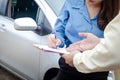 A woman driving a car has an accident during the rain. Royalty Free Stock Photo