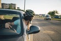 Woman driving car in helmet with horror on her face Royalty Free Stock Photo