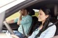 Woman driving car and man covering face with palm Royalty Free Stock Photo