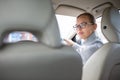 Woman driving a car - parking, going in reverse Royalty Free Stock Photo