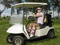 Woman Driving Golf Cart