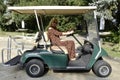 Woman driving golf carts