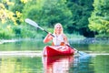 Woman driving with kayak on forest river Royalty Free Stock Photo