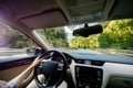 Woman driving luxury car on the difficult road highway in French mountains near Royalty Free Stock Photo