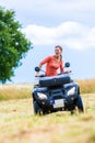 Woman driving off-road with quad bike Royalty Free Stock Photo