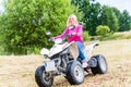 Woman driving off-road with quad bike Royalty Free Stock Photo