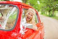 Woman driving a retro car