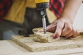 Woman driving into chipboard with gun