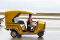 HAVANA, CUBA - OCTOBER 21, 2017: Woman Driving Tuk Tuk Taxi in Havana, Cuba Royalty Free Stock Photo