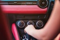 Woman driving, using a manual transmission stick shift. close up of woman shifting gears on gearbox and driving car selective