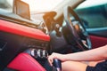 Woman driving, using a manual transmission stick shift. close up of woman shifting gears on gearbox and driving car selective Royalty Free Stock Photo