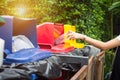 Young girl hand dropping plastic bottle into recycle bin. Royalty Free Stock Photo