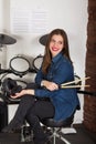 Woman drummer practicing at home Royalty Free Stock Photo