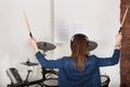 Woman drummer practicing at home Royalty Free Stock Photo