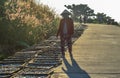 A woman drying fish on rural road