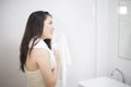 A woman is drying her hair with a towel after showering Royalty Free Stock Photo