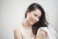 A woman is drying her hair with a towel after showering Royalty Free Stock Photo