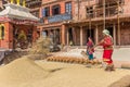 Woman drying rice at the pottery square of Bhaktapur