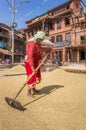 Woman drying rice at the pottery square of Bhaktapur