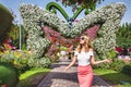 Woman in Dubai Garden portrait. Sunny day beautiful flowers backgrounds Royalty Free Stock Photo