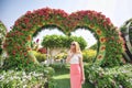 Woman in Dubai Garden portrait. Sunny day beautiful flowers backgrounds Royalty Free Stock Photo