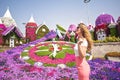 Woman in Dubai Garden portrait. Sunny day beautiful flowers backgrounds