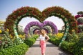 Woman in Dubai Garden portrait. Sunny day beautiful flowers backgrounds Royalty Free Stock Photo