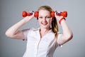 Woman with a dumbbell at the temples Royalty Free Stock Photo