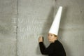 Woman with Dunce Cap Writing I WILL NOT Royalty Free Stock Photo