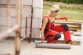 Woman installing pipes on construction site Royalty Free Stock Photo