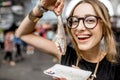 Woman with dutch herring Royalty Free Stock Photo