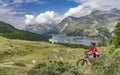 Woman with e mountainbike in the Engadin, Switzerland