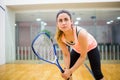 Woman eager to play squash Royalty Free Stock Photo