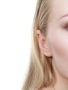 Woman ear closeup, half face picture Royalty Free Stock Photo