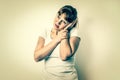 Woman with earache is holding her aching ear - retro style