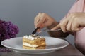 Woman eat cake and drink coffee and lilac