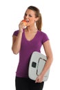 Woman Eating Apple and Holding Scale Royalty Free Stock Photo