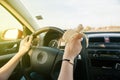 Woman eating banana while driving on highway Royalty Free Stock Photo