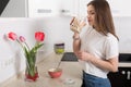 Woman eating breakfast at her kitchen Royalty Free Stock Photo