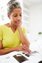 Woman Eating Breakfast And Reading Magazine Royalty Free Stock Photo