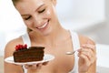 Woman Eating Cake. Beautiful Female Eating Dessert