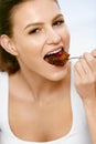 Woman Eating Cake. Beautiful Female Eating Dessert