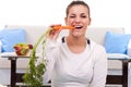 Woman eating a carrot Royalty Free Stock Photo